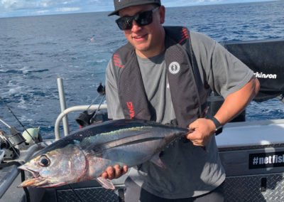 Larry holding a tuna fish